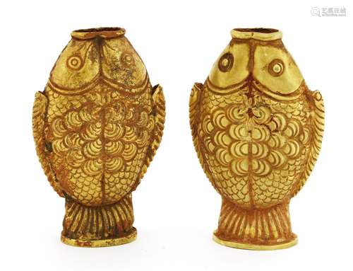 A pair of Chinese gold vases, of double-fish form, as two conjoined fish with tails forming the ...