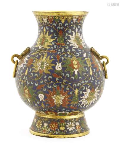 A Chinese cloisonné vase,  of baluster form on a splayed raised foot, enamelled with scrolling ...