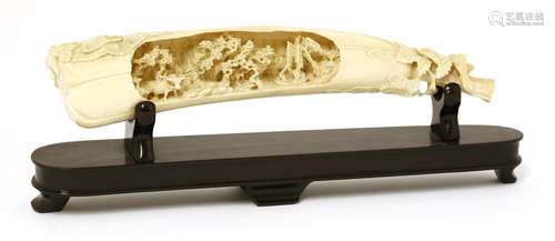 An ivory carving, late 19th century, of an elongated gourd surrounded by scrolling leaves, the ...