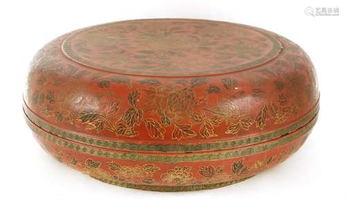 A large Chinese lacquered box and cover, 19th century, of circular form, incised with sprigs of ...