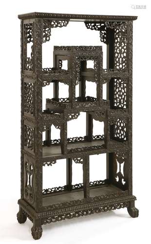 A Chinese blackwood display cabinet, 19th century, pierced and carved with scrolling lotus, on a ...