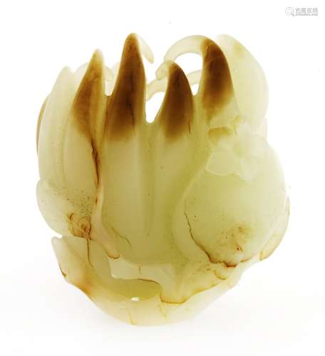 A Chinese jade carving, Qing dynasty (1644-1911), of a finger citron, together with a peach and a ...