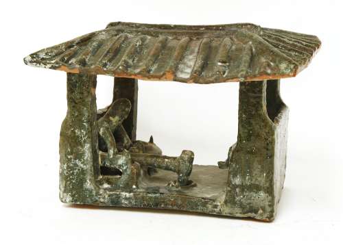 A Chinese barn model,  Han dynasty (206 BC to AD 220), of rectangular form with four pillars ...