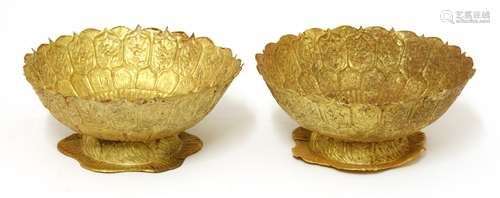 A pair of Chinese gold stem bowls, of circular lobed form on lobed feet, the sides engraved with ...