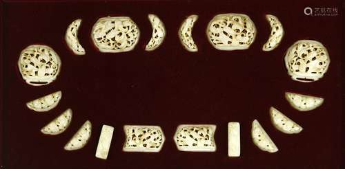 A set of Chinese jade belt fittings, comprising eighteen plaques of various shapes, each pierced ...