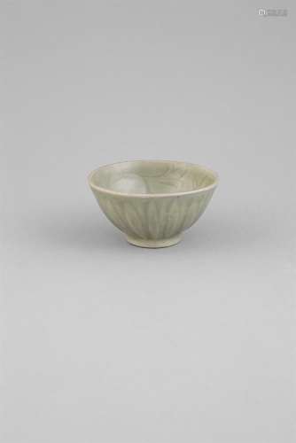 A LONGQUAN CELADON GLAZED BOWL, Ming Dynasty (1368-1644) of circular form, the interior carved