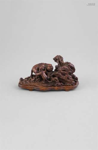 A CARVED ROOTWOOD 'QILIN' GROUP AND STAND, 18th/19th century, the fantastic animal depicted