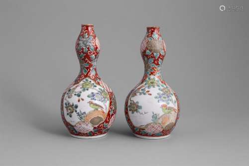 A PAIR OF KUTANI WARE DOUBLE GOURD VASES, the pear shaped body with asymmetrical reserves, painted