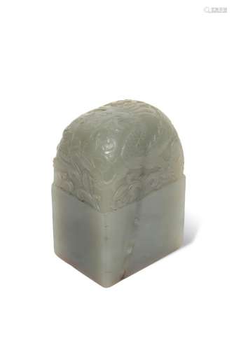A CELADON JADE 'DRAGON' SEAL, 18th/19th centurymodelled as a cubic block, tightly carved with a