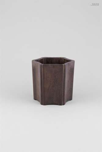 A ZITAN WOOD HEXAGONAL BRUSHPOT, 18th Century, with concave side panels and re-entrant corners,