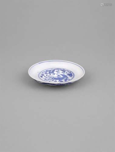 A BLUE AND WHITE DRAGON AND PHOENIX DISH, with six character Wanli mark, of shallow circular form