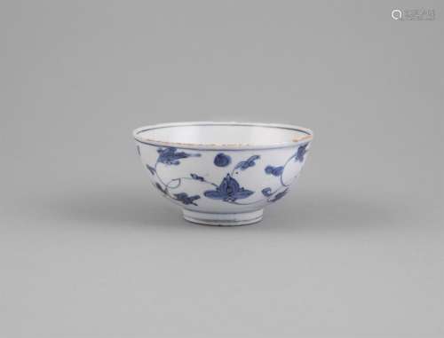 A MING BLUE AND WHITE HEMISPHERICAL BOWL, Wanli (1572 - 1620), the exterior freely painted with an