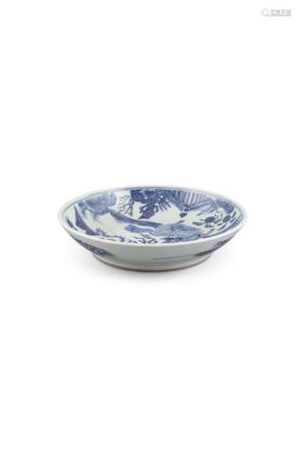 A BLUE AND WHITE 'PHOENIX AND QILIN' DISH, 18th Century, the central reserve painted with a qilin