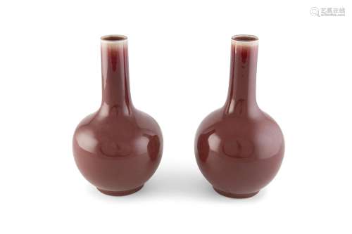 A PAIR OF QING PERIOD 'SANG DE BOEUF' GLAZED VASES, c.1850, each with globular body and