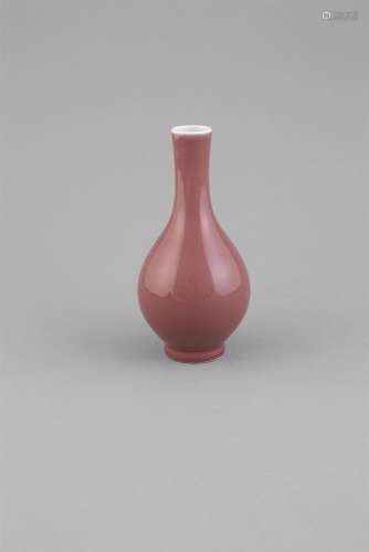 A COPPER-RED BOTTLE VASE, C.1800, the pear shaped body rising from a slightly splayed foot,