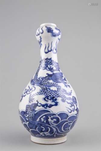A BLUE AND WHITE GARLIC BULB DRAGON VASE, Qianlong seal mark but later, the pear shaped body