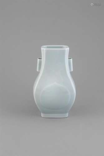A PALE CELADON 'HU' VASE, Guangxu (1875-1908) of flattened pear shape, with re-entrant corners and