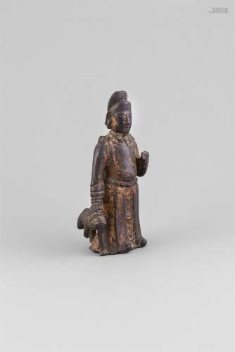 A GILT BRONZE GROUP OF AN OFFICIAL WITH DOG,Ming Dynasty (1368 - 1644), cast with head dress and