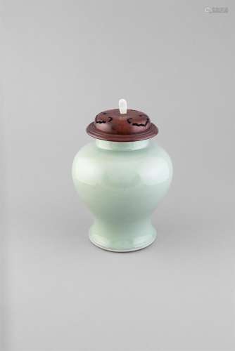 A LARGE MONOCHROME CELADON VASE, 18th Century, fitted with hardwood cover and jadeite finial, the
