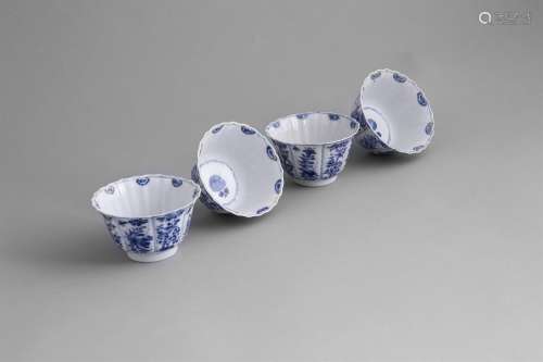 A SET OF FOUR FLARED BLUE AND WHITE CUPS, 19th century, of tapering design, each with wavy rims,