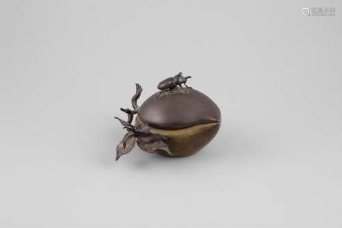 A GILT BRONZE PEACH SHAPED BOX AND COVER, Meiji Period (1868 - 1912), patinated in two tones, the