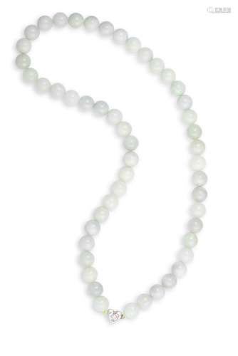 A JADEITE BEAD NECKLACE, centred by a heart-shaped white metal and paste clasp, length approximately