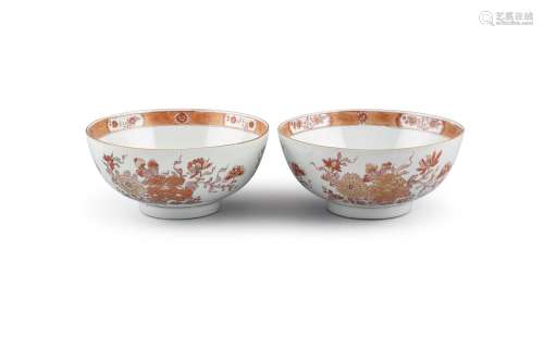 A PAIR OF IRON-RED AND GILT DECORATED BOWLS, 18th Century, each decorated with floral groups