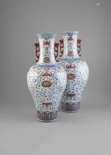 A LARGE PAIR OF DOUCAI ENAMELLED LOTUS VASES, Daoguang (1821 - 1850), of baluster shape, colourfully