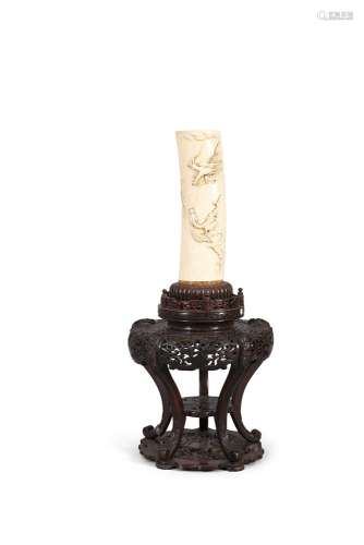 A LARGE CARVED IVORY TUSK ON STAND, 19th century, with continuous scene of aerial three claw dragons