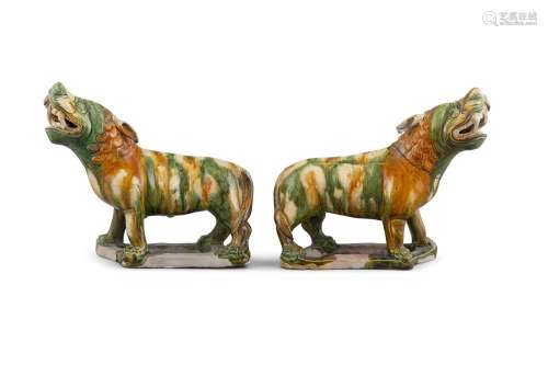 A PAIR OF SANCAI GLAZED LIONS,probably 17th century, modelling in mirror image, each standingwith
