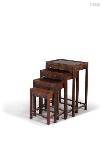 A HARDWOOD NEST OF QUARTETTO TABLES, c.1900, each of rectangular shape and graduating in size carved