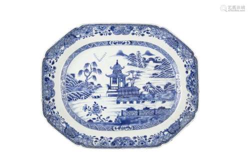 A LARGE BLUE AND WHITE OBLONG DISH, C.1800, with raised sides and canted corners, painted in