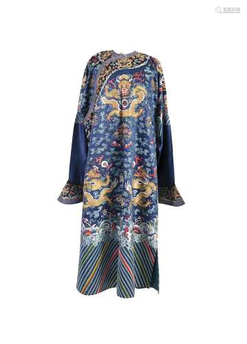 A CHINESE BLUE-GROUND EMBROIDERED NINE-DRAGON ROBE, jifu, mid nineteenth century, embroidered with