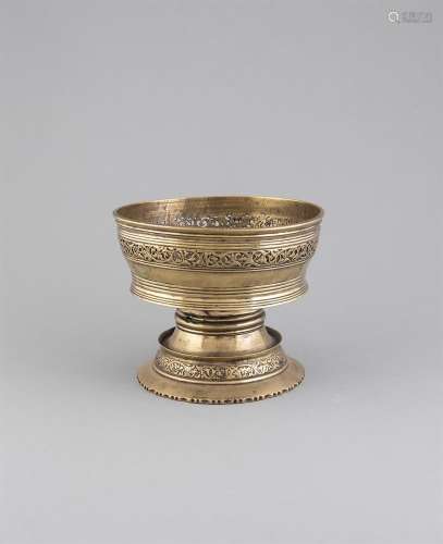 A TIBETAN BUTTER LAMP, 18/19th Century with broad bowl pierced with a band of leafy scrolls, on a