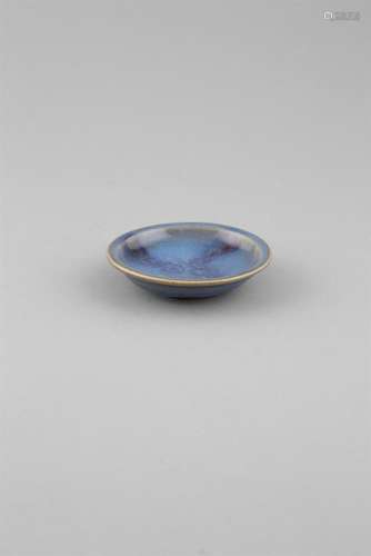 A JUN YAO-TYPE DISH, of shallow circular shape, covered in a lapis-blue glaze with copper splash, on