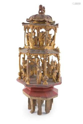 A CARVED GILTWOOD PAGODA, surmounted with a kylin animal finial above two open tiers, fitted with