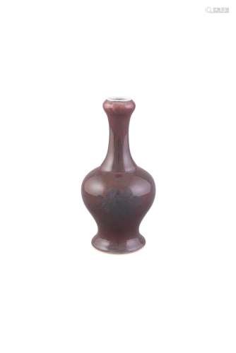 A COPPER-RED GARLIC BULB MONOCHROME VASE, KANGXI MARK (1662-1722) covered in a deep cherry-red glaze