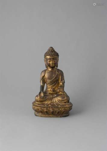 A GILT BRONZE MODEL OF A SEATED BUDDAH, Qing Dynasty (1644-1911) in meditative pose, holding a