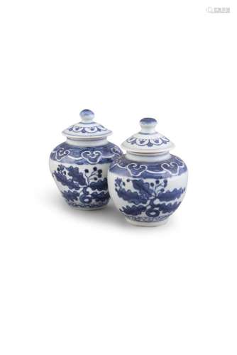 A PAIR OF BLUE AND WHITE OVIFORM JARS AND COVERS, MING DYNASTY (1368-1644) the domed tops with