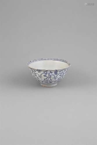 A MING DYNASTY BLUE AND WHITE CARGO BOWL, c.1550, of deep circular form with barbed rim, decorated