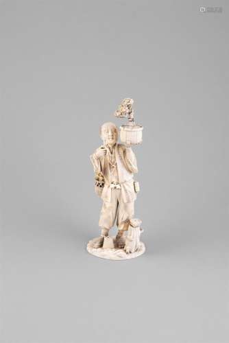 A LARGE JAPANESE CARVED IVORY OKIMONO, 19th century, of a bonsai keeper, standing holding a loft a