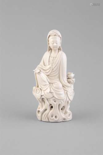 A BLANC DE CHINE MODEL OF GUANYIN,C.1700, seated at royal ease wearing a beadednecklace and draped