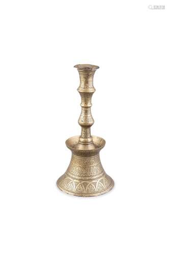 A LARGE ISLAMIC BRASS CANDLESTICK, Ottoman, 18th century, with flared socket and waisted neck with