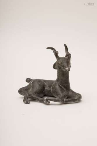 Set of three silver and brass objects A stag lyin...