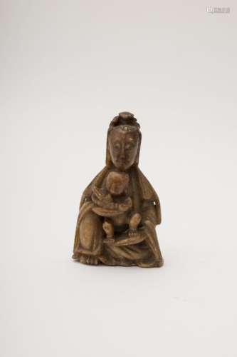 Guanyin Stone, seated and holding a child in her ...