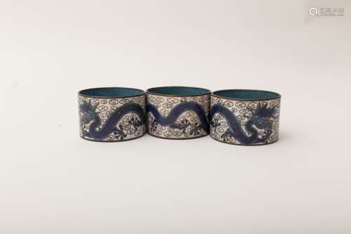 Three napkin rings Cloisonné enamel featuring the...
