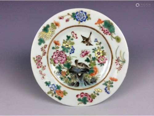 Chinese famille rose saucer painted with flower and bird, mark on base.