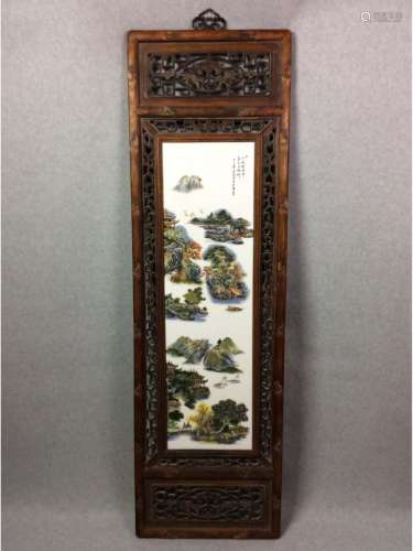 Chinese framed porcelain plaque painted with landscaping and calligraphy inscription.