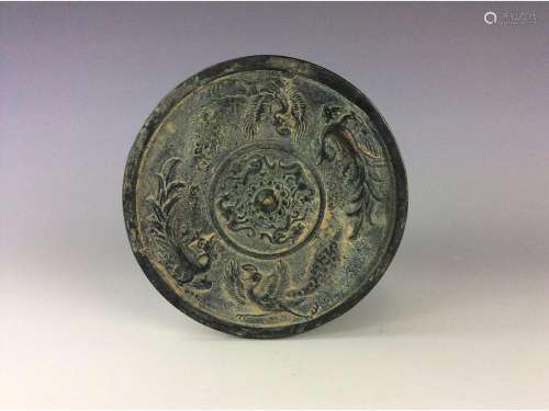Chinese circular bronze mirror.