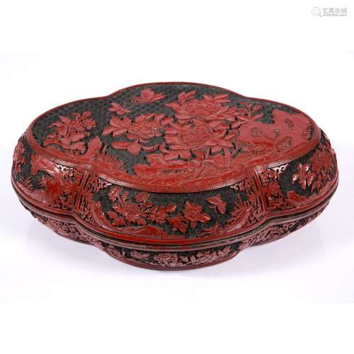 Lacquer box and cover Chinese, 19th century Qianlong mark, of quatrefoil shape, carved depicting